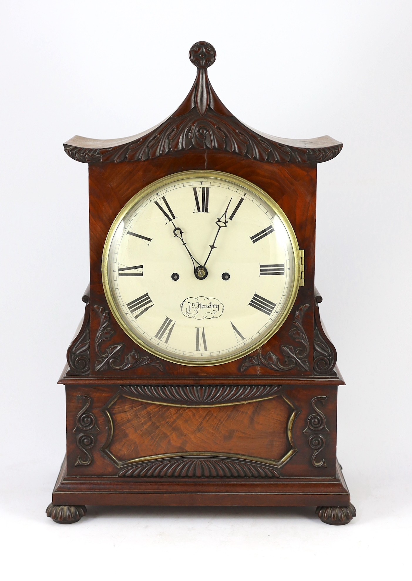 J. N. Hendry. A William IV carved mahogany pagoda top bracket clock, 36cm wide 20cm deep 54cm high